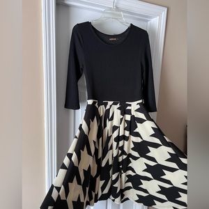 Black sweater dress with chevron skirt